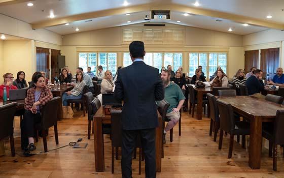 view of attendees from behind the speaker