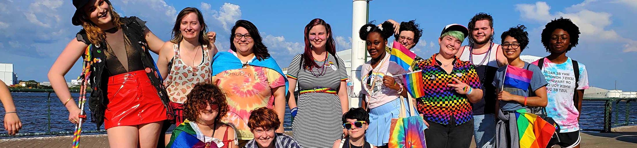 A group of Spectrum students in front of water.